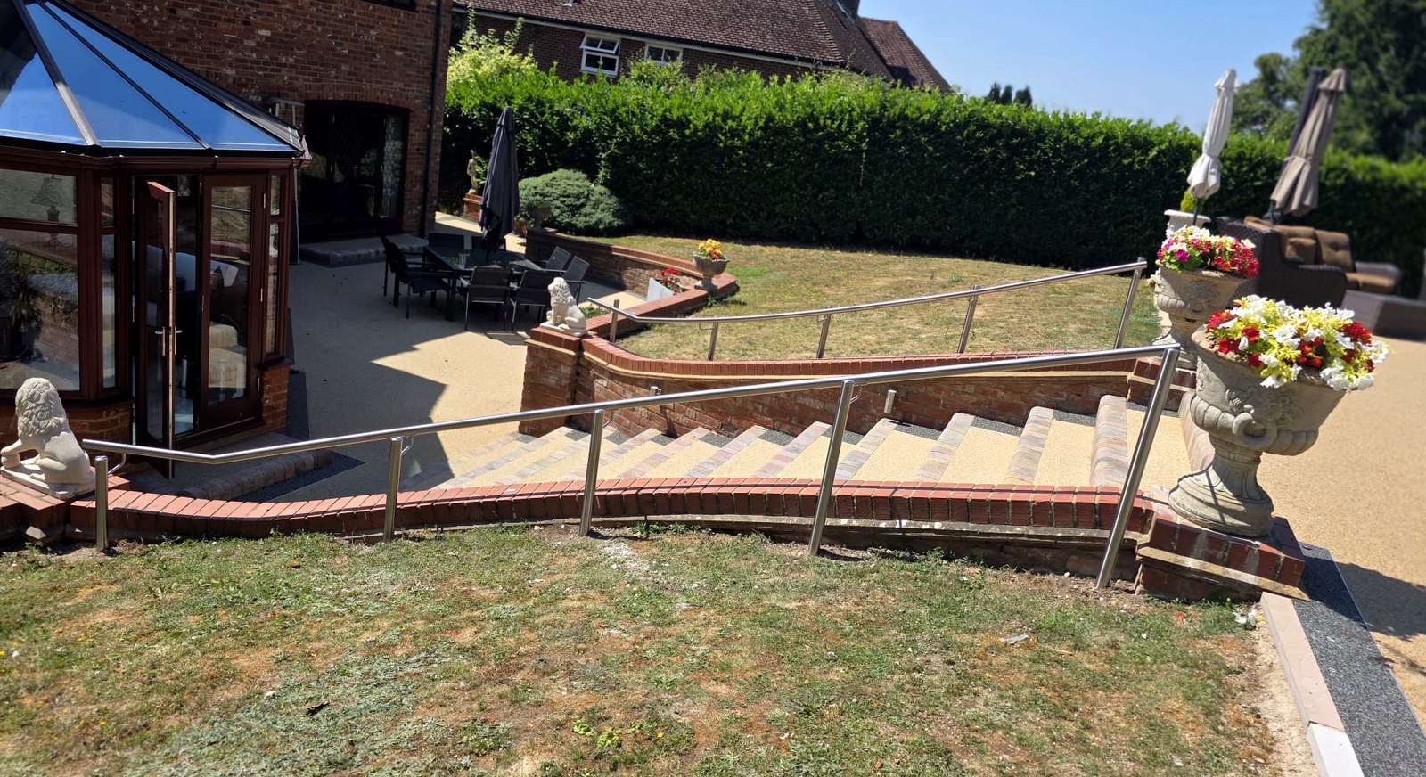 Curved 316 stainless steel handrail on posts to garden steps, Beaconsfield, Buckinghamshire